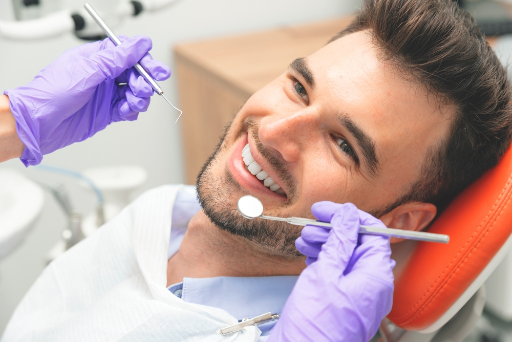 Handsome,Young,Man,In,Stomatology,Clinic.,Dental,Care